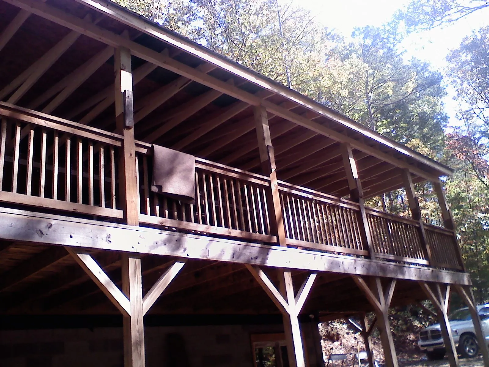 Timber framing under a new elevated porch and deck — Roof Leak Repair in Murray City by Roofing Brothers